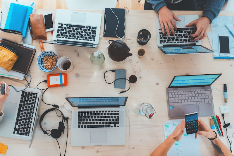 Team members gathered with laptops, exploring the evolution of search engines and the integration of AI in modern search platforms